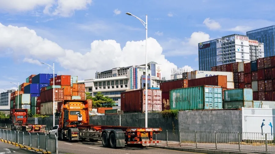 Heavy chassis equipment entering a port facility.